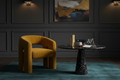 Atmospheric interior shot of the Mustard Velvet Tub Chair