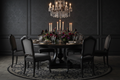 Ebony round pedestal dining table styled for 8 in luxury dining room