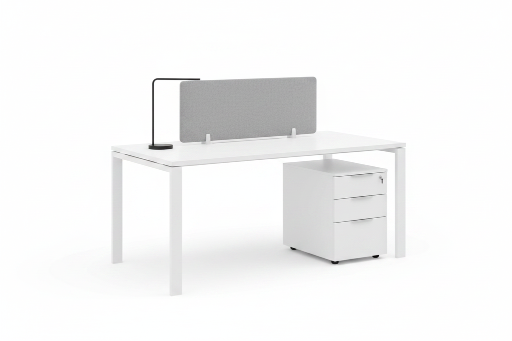 Modular white office desk with acoustic divider and single pedestal cabinet on white background