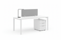 Modular white office desk with acoustic divider and single pedestal cabinet on white background